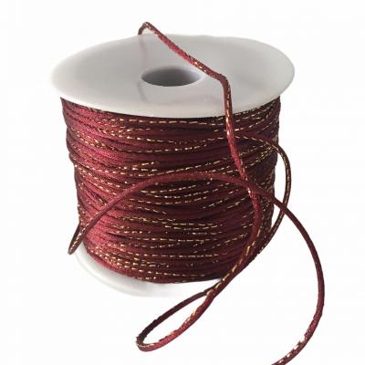 Cordon bordeaux lurex 2 mm.