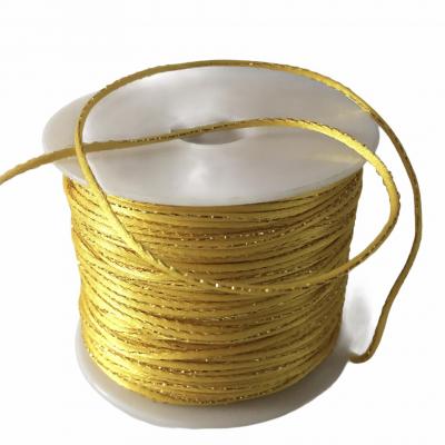 Cordon jaune lurex 2 mm.